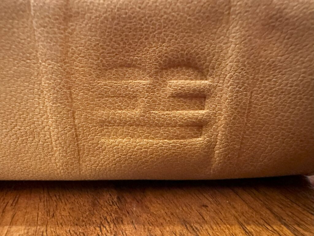 NLT canyon goatskin spine highlighting "HB" stamped logo